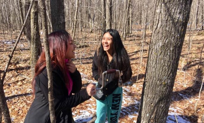 learners laughing outside in the forest