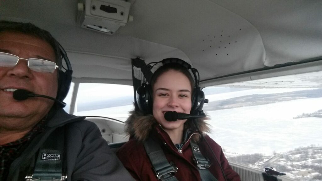 Julie Torres and pilot in a Maule aircraft flying over Vermont