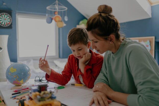 parent and child at a desk together