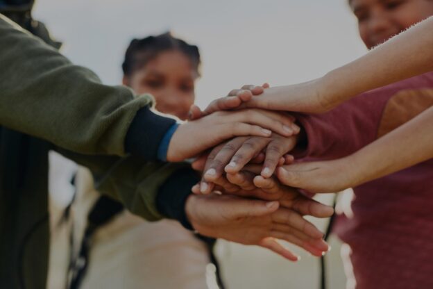 hands on top of each other showing teamwork