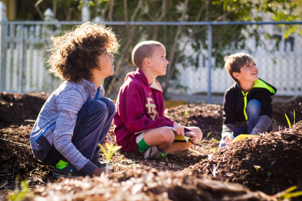 group of young learners in a garden