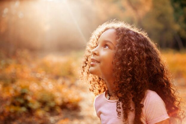 young learner illuminated by a ray of sunshine