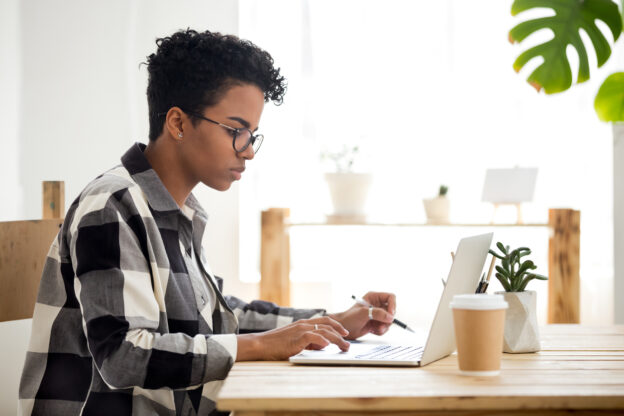 Woman using laptop working studying online