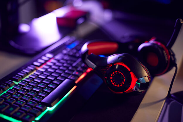 close up photo of headphones and a keyboard