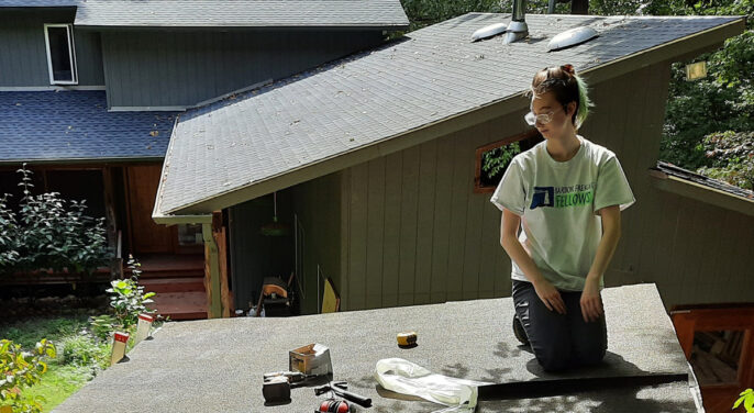 Fiona nelson on a roof building