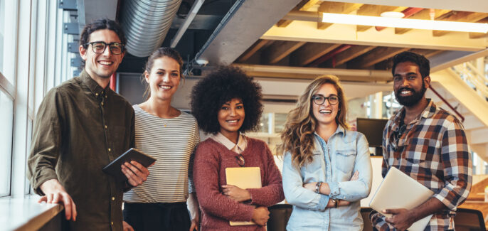 Group photo of five people from a small startup companies. Entrepreneurs doing business.