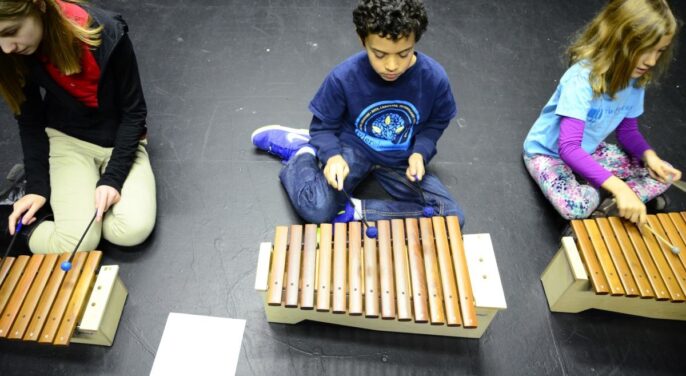 learners playing the xylophone