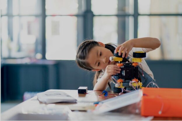 young learner building an robotic prototype