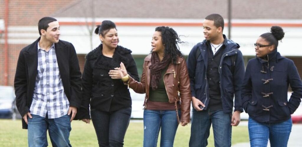 group of learners standing together wearing coats