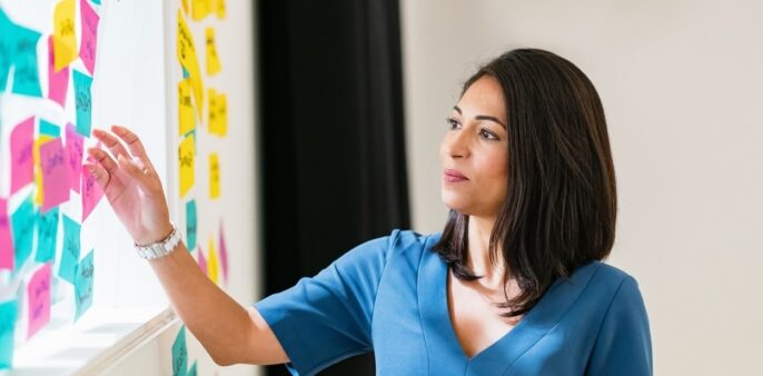 practitioner putting up post-it notes