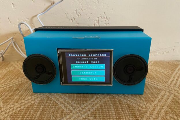 photo of a cardboard radio prototype with an electronic screen