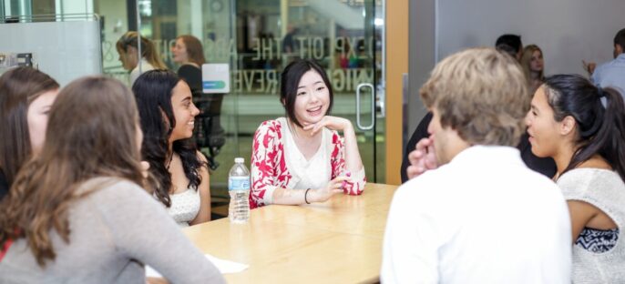 group of learners sitting around a table