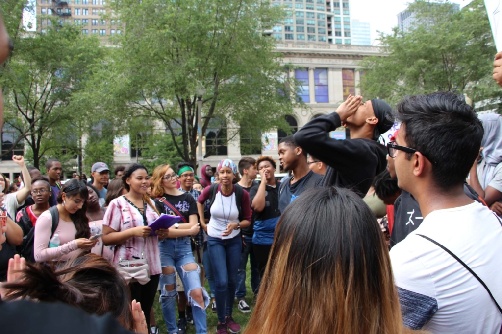 Mikva Challenge DC learners using their voices outside in a group in DC