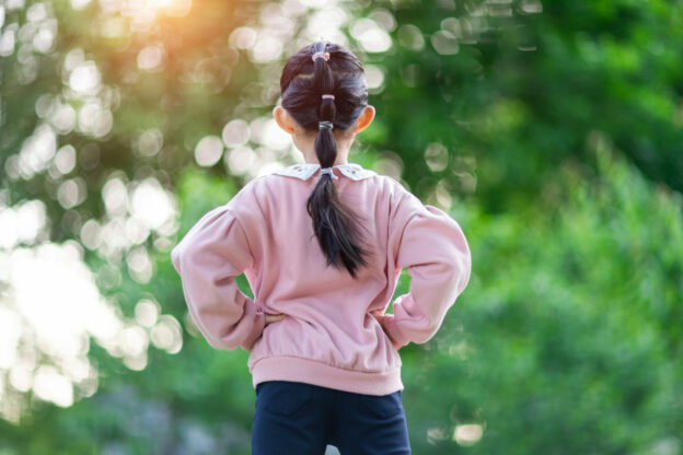 photo of a young learner with her hands on her hips