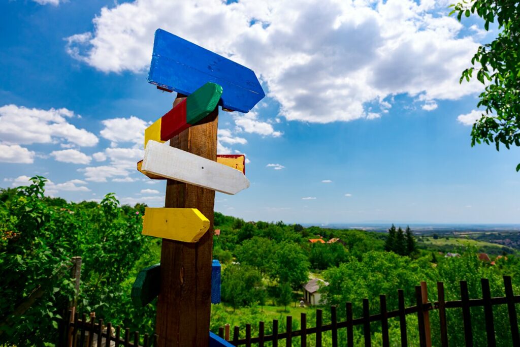 photo of trail signs in multiple directions