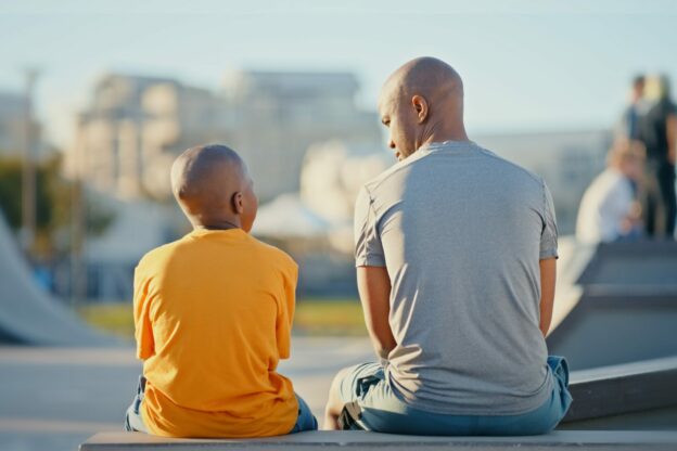 older man and younger boy sitting together