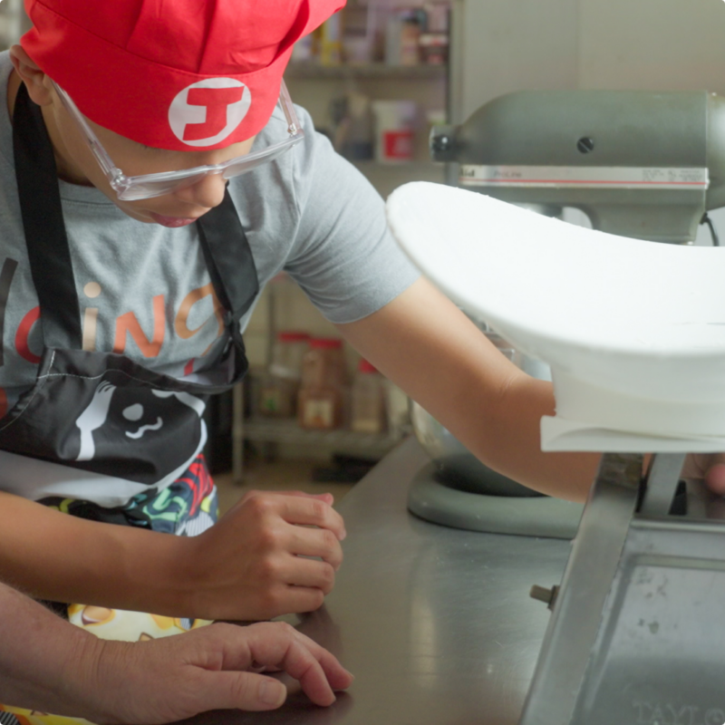 The Met learner baking in a kitchen