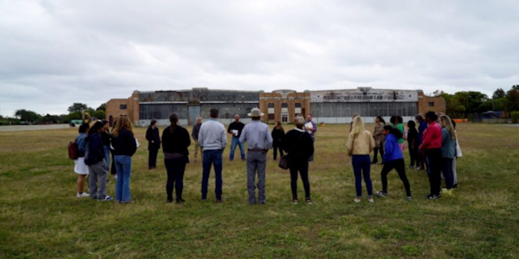 group at the site of Runway Green