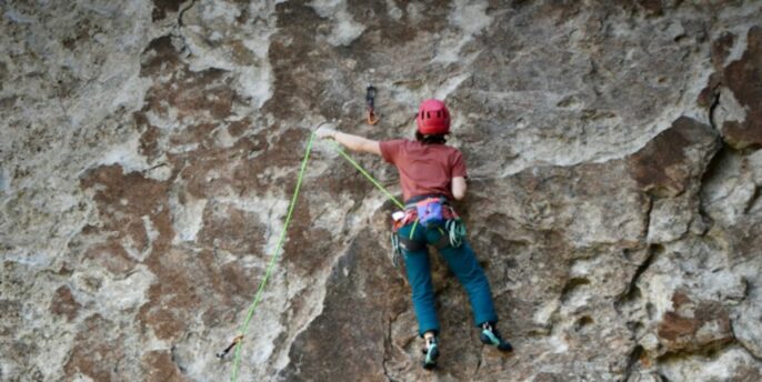 learner rock climbing